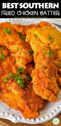 fried chicken on a white plate with parsley garnish and the words best southern fried chicken batter