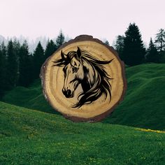 a tree stump with a horse painted on it