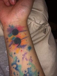 a person with a colorful tattoo on their arm