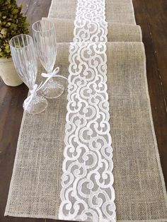 the table runner is decorated with white lace