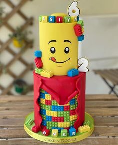 a birthday cake made to look like a lego character