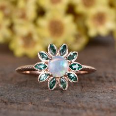 Natural Opal emerald ring, marquise emerald leaf flower halo design, unique milgrain wedding band rose gold ITEM DESCRIPTION Opal engagement ring ✦Solid 14k white/ rose/yellow gold ✦Approx Band width approx 1.5mm(bottom) ✦5mm Round cut 0.5ctw VS natural Opal ✦1.5x3mm Marquise cut lab emeralds ✦Prong Set Jewelry maintenance tips ▶ To avoid of chemical reactions,do not touch with daily chemicals,such as soap,shower gel,shampoo,chemicals. ▶ To avoid deformation or breakage on any collision or stres Elegant Cluster Birthstone Jewelry, Emerald Jewelry With Marquise Cut Center Stone, Cluster Ring For Wedding With May Birthstone, Elegant May Birthstone Flower Ring With Gemstone, Cluster Halo Design Jewelry Gift, Cluster Halo Design Jewelry As Gift, Halo Design Cluster Jewelry As A Gift, Emerald Halo Jewelry With Round Cut, Halo Emerald Jewelry With Round Cut