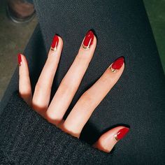 Make a red nail instantly more glamorous with a metallic accent. Start with a clear base coat and then paint your half moons in gold. Let dry, then fill in the rest of the nail in your favorite red polish. Finish with a topcoat. Red And Gold Nails, Nails Red, Super Nails, Red Nail, Wear Red