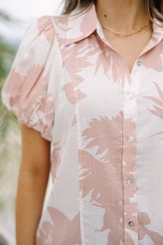 This blouse is so cute! We love the muted coloring of that tropical floral print. The cut of this blouse also makes it great for work or weekends. Who doesn't love versatility! Collared neckline Button down front closure Short bubble sleeves Tropical floral print No stretch Savannah is wearing the small. Hawaiian Style Tops With Button Closure For Spring, Collared Hibiscus Print Top For Spring, Collared Tops With Hibiscus Print For Spring, Casual Collared Blouse With Tropical Print, Short Sleeve Leaf Print Spring Top, Tropical Print Button-up Blouse For Vacation, Vacation Floral Print Button-up Blouse, Vacation Tropical Print Button-up Blouse, Spring Leaf Print Short Sleeve Tops