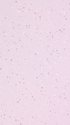 a pink background with small stars on it