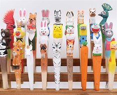 a group of wooden toy animals standing next to each other