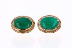 Featured here is a beautiful set of oval cut cabochon emerald studs in fine 14K yellow gold. Displayed are rich-green emeralds with very good transparency, accented by a simple bezel set victorian gold mount, allowing for the emerald to be shown in full view. The earth-mined, green cabochon emeralds have a desirable lush green color with excellent qualities. These earrings are ideal for everyday use and are the perfect accessory to any outfit. Setting Style: Bezel Setting Material: 14K Yellow Go Fine Jewelry Green Cabochons For Formal Occasions, Oval Yellow Gold Cabochons For Formal Events, Green Cabochons For Formal Fine Jewelry, Oval Cabochons For Formal Wear Fine Jewelry, Elegant Green Cabochons For Formal Occasion, Elegant Green Cabochons As Gifts, Elegant Green Cabochons For Gifts, Formal Emerald Jewelry With Oval Cabochon, Emerald Cabochon Earrings As A Gift