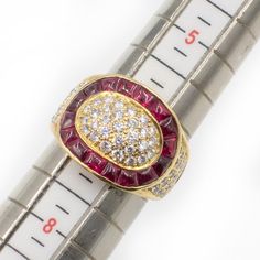 1990s Diamond Ruby Cocktail Ring set in 18K yellow gold encrusted with Diamonds (G-H color/VS clarity) and Calibre-cut Rubies  Ring Size: 6.75  Approximate Weight: Gross - 9.80 grams Diamonds - 0.99 carat Ruby - 2.85 carats  Approximate Band Measurement: Front - 0.61" Back - 3.9mm  Hallmarks: 18K, 2.85, 0.99 Ruby Cocktail, Cocktail Ring, Cocktail Rings, Ring Set, Ring Sets, Gold Diamond, Ruby, Ring Size, Diamonds