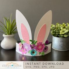 a paper bunny ears headband with flowers on it