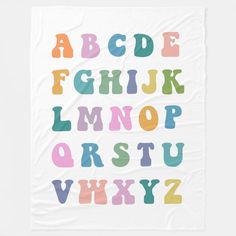 the alphabet is made up of different colors and font, including letters that appear to be painted