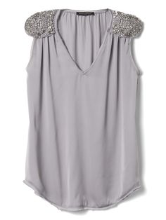 BR Glamorous Embellished Sleeveless Blouse, Glamorous Embellished Sleeveless Top, Elegant Sleeveless Blouse With Sequins, Chic Sleeveless Embellished Tops, Chic Embellished Tank Top, Chic Silver Sleeveless Top, Elegant Embellished Sleeveless Blouse, Sleeveless Embellished Blouse For Night Out, Sleeveless Embellished Tops For Night Out