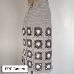 a crocheted skirt is displayed on a mannequin