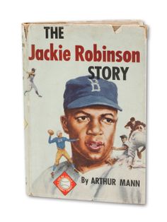 an old book with a baseball player wearing a blue hat on it's cover