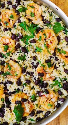 rice with shrimp and black beans in a pan