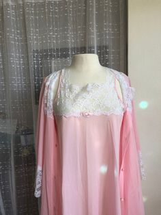 Vintage Pink Nightgown// Peignoir Set//Size M//Miss Elaine//MINT//Pink Babydoll nightgown//Robe//Union Made in the USA Simply DARLING! MINT, never worn, the Miss Elaine and the union tag are crisp and new. Like wearing a pink cloud trimmed in white cloud lace! Seen here on a size 8 dress form. Nylon. Covered buttons. Lave to the hem of both pieces. Armpit to same: 40 Length: 40 ( right above the knees) Sweep: 104 Very Betty Draper. From a time when this country had union garment workers and a st Pink Long Sleeve Set With Lace Trim, Pink Long Sleeve Sets With Lace Trim, Pink Lace Trim Long Sleeve Set, Pink Feminine Robe For Sleepover, Feminine Pink Robe For Sleepover, Pink Feminine Sleepwear For Wedding, Feminine Pink Sleepwear For Wedding, Pink Lace Trim Pajama Party Sets, Pink Vintage Sleepwear