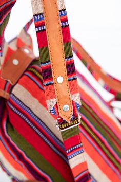 One of a Kind - ﻿﻿Guatemalan Huipil Bag The ultimate back-to-school backpack, each of these Guatemalan leather backpacks is as colorful as it is cultural. Each colorful backpack is handmade from sueded leather and huipil fabric used for traje tipico or traditional dress in different regions of Guatemala. Coupled with padded backs made of multicolored traditional jaspe textiles, each one of these colorful leather backpacks is as unique as you are. The red huipil fabrics are from the town of Nebaj Handmade Multicolor Travel Backpack, Traditional Multicolor Backpack For Travel, Multicolor Leather Standard Backpack, Multicolor Leather Backpack For Travel, Multicolor Backpack With Adjustable Strap For Festivals, Multicolor Leather Backpack With Adjustable Strap For Travel, Multicolor Rectangular Leather Backpack With Adjustable Strap, Bohemian Multicolor Backpack With Adjustable Strap, Multicolor Bohemian Backpack For Everyday Use