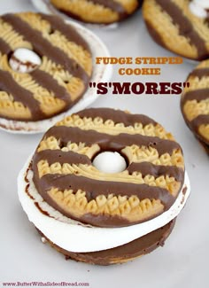 there are some cookies with chocolate frosting on them and the words fudge stripe cookie s'mores