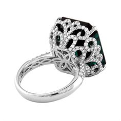 Stunning Tourmaline Ring The ring is 18K White Gold The center is 22.17 Carats Dark Bluish Tourmaline The Tourmaline is GIA Certified No Heat There are 1.22 Carats in Diamonds F/G VS/SI The ring is a size 6.5, sizable. The ring weighs 10.6 grams. Luxury Tourmaline Emerald Ring, Luxury Cushion Cut Emerald Ring, Luxury Green Cushion Cut Diamond Ring, Luxury Tourmaline Ring With Center Stone, Luxury Prong-set Cushion Cut Emerald Ring, Luxury Cushion Cut Emerald Ring With Prong Setting, Luxury Silver Emerald Ring With Cushion Cut, Elegant Green Evening Rings, Oval Halo Ring