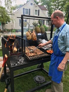 a man grilling food on an outdoor grill