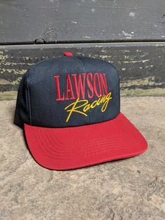 Vintage 90's Lawson Racing NHRA Hit Rod Drag Racing Snapback Hat. Has fading, spots, discoloring, yellowing on headband and other wear. NO holes. In good vintage condition... Ready To Wear One Size Fits Most. Vintage Snapback Hat With Curved Bill For Sports, Vintage Style Snapback Hat With Letter Print For Streetwear, Vintage Letter Print Snapback Hat For Streetwear, Retro Trucker Hat With Letter Print For Sports, Retro Letter Print Trucker Hat For Sports, Vintage Sports Hat With Letter Print, Hat Ideas, Drag Racing, Hat Cap