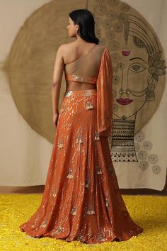 Rust orange textured lehenga with placement embroidery. Paired with a gathered blouse with matching texture and embroidery on neckline and a ruffled net dupatta. - Aza Fashions Cape Lehenga, Ruffle Dupatta, Sequined Blouse, Lehenga And Blouse, Orange Lehenga, Kurta Lehenga, Lehenga Pattern, Orange Texture, Lehenga Skirt