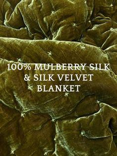 a bed covered in green velvet with stars on the side and text reading 100 % mulberry silk & silk velvet blanket