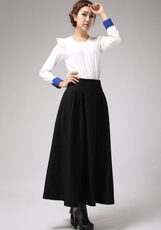 "This black wool skirt designed with pleated front and high fitted waist. Also, two hip pockets and side zip closure for more convenient wear. It is made of soft wool blend and it has lining.the lady skirt with a maxi length is really a good choice for winter. This skirt can be a basic piece in your wardrobe. Due to it classic cut and rich solid color it can be easily matches with many different styles. DETAIL * 30% wool, 30% fiber, 40% polyester * polyester lining * Seam pocket * Right zipper c Black Maxi Skirt For Work, Black Maxi Bottoms For Work, Formal Full-length Pleated Maxi Skirt, Fall Maxi Length Skirt, Elegant Wide Leg Maxi Skirt For Office, Lined Maxi Skirt For Workwear, Elegant Wide-leg Maxi Skirt For Office, Solid Full Maxi Skirt For Workwear, Full Maxi Skirt For Workwear