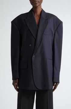 Balenciaga's bent for the bold shines through the powerfully proportioned shoulders and slightly off-center closure of a rich wool blazer crafted in Italy. 30" length (size 2) Asymmetric button closure Notched lapels Four-button cuffs Front welt pockets; front flap pocket Lined 100% wool Dry clean Made in Italy Designer Clothing Designer Formal Blazer With Concealed Front Fastening, Formal Blazer With Concealed Fastening For Fall, Formal Fall Blazer With Concealed Front Fastening, Formal Blazer With Concealed Front For Fall, Formal Winter Blazer With Concealed Front Fastening, Formal Structured Blazer With Concealed Front Fastening, Structured Blazer With Concealed Front Fastening For Formal Occasions, Modern Business Blazer With Concealed Front Fastening, Wool Business Blazer With Concealed Front Fastening