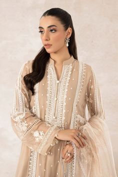 Pakistani Salwar Kameez Beige Shade Salwar Suit Dupatta s an embroidered masterpiece that will give you a head-turning elegant look on a formal occasion. Lavish designs and fine floral designs make this Pakistani Party Dress an epitome of beauty and grace. Elegant Churidar With Floral Embroidery In Chanderi, Elegant Chanderi Churidar With Floral Embroidery, Elegant Churidar With Floral Embroidery And Traditional Drape, Elegant Floral Embroidered Churidar For Weddings, Designer Semi-stitched Beige Churidar, Cream Semi-stitched Churidar, Fitted Beige Anarkali Set With Dupatta, Formal Chanderi Traditional Wear With Floral Embroidery, Elegant Sharara With Floral Embroidery And Straight Kurta