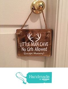 a little man cave no girls allowed except mommy sign hanging on the front door handle