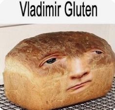 a loaf of bread with the face of a man on it's side and text that reads, viadimr gluten