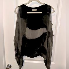 Italian Silk Blouse! Brand New Never Worn. Lined As A Tank Top And See Through Silk Lining Over It With Flutter Sleeves And Open Shoulders. Black And Gray Design, Bunched At The Bottom. One Size Product, But Generally Fits Xs-L Sizes. Chic Gray Summer Blouse, Chic Gray Evening Tops, Elegant Black Top With Overlay, Gray Tops For Spring Evening, Gray Tops For Evening In Spring, Black Spring Tops With Overlay, Black Top With Overlay For Spring, Black Sleeveless Blouse For Fall, Casual Sleeveless Blouse For Evening