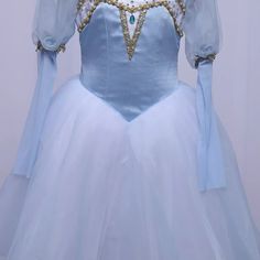 A very pretty Degas knee-length tutu in a lovely shade of sky blue. It is a very suitable costume for Swan Lake Pas de Trois. The bodice of this tutu is made with sky blue satin, with gold decorations. There are long sleeves in the typical medieval style. The Degas tutu skirt is made with of soft white English net and blue organza. Custom made. Delivery time: 4 to 5 weeks Price: $ 350 + shipping Blue Tulle Princess Dress With Long Sleeves, Blue Long Sleeve Tulle Princess Dress, Blue Fairytale Costume For Costume Party, Fairytale Blue Costumes For Costume Party, Blue Fairytale Princess Dress For Costume Party, Blue Fairytale Princess Dress For Fancy Dress, Blue Princess Costume For Fancy Dress, Blue Princess Style Fancy Dress Costume, Fitted Princess Costume With Tulle