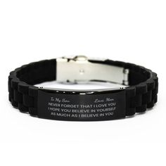 a black rubber bracelet with an inscription on the front and back, that says hold holding started out as hammers hobby i had no fear it would come to this