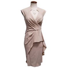 Badgley Mischka Collection V-Neck Surplice Wrap Peplum Ruffle Midi Gown Color: Beige Size: 4 (Fits Very Slim, Could Fit A 2) Retail: $420 New With Tags! Now 60% Off Notched V-Neck Surplice Wrap Front Sleeveless Midi Gown With Asymmetrical Peplum Ruffle Layered Midi Skirt. Stretch Jersey Crepe Is Body-Hugging And Oh-So Figure Flattering. Has A 9" Side Slit On The Left Side. Hidden Center Back Zip With Gathering At The Waist. Material & Care: Shell Is 60% Acetate, 40% Polyethylene; Lining Is 100% Polyester Dry Clean Only Measurements (Unstretched): 29" Bust, 26" Waist, 34" Hip, 41" Total Length Midi Gown, Midi Gowns, Badgley Mischka, Midi Skirt, Size 4, Dry Clean, Midi Dress, V Neck, Womens Dresses