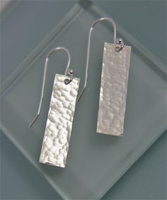 "These earrings are Sterling Silver Rectangles 1\" long by 3/8\" wide simple and just the right size, they are hammered, punched, and polished to a bright shine. They are hanging on a simple sterling silver ball earwire. Substsantial yet light every day earrings. Made from Recycled Silver. All items are presented in a 100% recycled paper box with a paper raffia bow. Thank you for looking at my shop. http://www.etsy.com/shop/tinysparklestudio?ref=si_shop For vintage clothing and uniquities, check Sterling Silver Jewelry Cleaner, Recycled Silver Jewelry, Homemade Jewellery, Silver Wire Jewelry, Simple Silver Earrings, Stamped Necklaces, Metal Stamped Jewelry, Silver Jewelry Box, Silver Wedding Jewelry