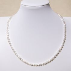 Simply small oval pearl necklace with no additional decoration. Oval shape pearls gives a feeling of causal, not as serious as round pearls. It's perfect to wear it as a layering necklace! Pearl Type: Freshwater Pearls Pearl Quality: AA+ [Shape]: Oval [Pearl Size]: 4-5mm [Blemish]: Minimal [Luster]: Very High Length: 45cm Chain Material: 14k White Gold Filled Single Strand Oval Pearl Necklace For Gift, Oval Single Strand Pearl Necklace As A Gift, Everyday Oval White Necklace, Classic White Oval Necklaces, Classic Oval Pearl Necklace, Classic Oval Beads Necklace For Gift, Classic Oval Beads Necklaces For Gifts, Oval Pearl Necklace, White Oval Single Strand Necklace