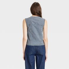 This Button-Front Denim Vest from Universal Thread™ will make a cool addition to your denim collection. Made from midweight cotton fabric with added stretch in a regular fit, it offers comfortable all-day wear. The flattering V-neckline, button-front design and chest flap pockets add touches of classic style. You can wear this sleeveless denim vest with high-waist pants, skirts and more for a variety of chic ensembles. Universal Thread™: Found exclusively at Target. Medium Wash Washed Denim Top, Casual Cotton Jeans With Snap Buttons, Cotton Jeans With Snap Buttons In Medium Wash, Medium Wash Cotton Jeans With Snap Buttons, Casual Stretch Denim Vest In Cotton, Casual Stretch Cotton Denim Vest, Trendy Cotton Denim Vest With Snap Buttons, Trendy Relaxed Fit Cotton Denim Vest, Trendy Relaxed Cotton Denim Vest