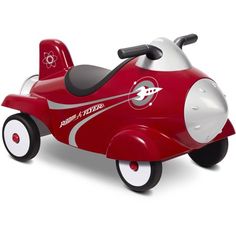 a red and white toy car with wheels on it's front wheel, which is shaped like a plane