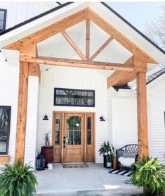 a white house with a wooden front door