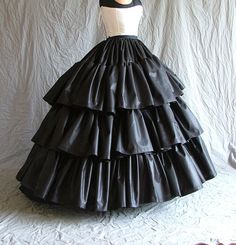 Vintage Full Skirt Petticoat For Costume, Victorian Petticoat For Costume, Victorian Petticoat With Attached Cancan For Costume, Victorian Skirt With Ruffles, Victorian Style Ruffled Petticoat For Costume, Victorian Ruffled Petticoat For Costumes, Victorian Style Crinoline Ball Gown Dress, Historical Victorian Ball Gown With Ruffles, Victorian Ball Gown With Ruffles And Crinoline