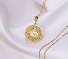 Embrace the serenity and profound symbolism of the Om pendant, a timeless piece that embodies the essence of spiritual enlightenment. This exquisite pendant features the sacred syllable "Om," revered as the primordial sound of creation in Hinduism, Buddhism, and other ancient traditions. * Gender : Male / Female * Material Options : 14K Solid Gold , 925 Sterling Silver, 14K Gold Plated , Rose Plated  * Gold plated and rose gold plated options are 14 carat and are made on silver. * The thickness of the silver and plated necklaces is 1 mm. * The thickness of the 14K  Solid Gold Pendant is 0.8 mm * The chain will be sent in the same material you selected. * The necklace size on the model in the photos is 20 mm. Chain lenght is 20 inches (50cm) * 3-piece chain length is standard and suitable f Gold Pendant Designs Indian, Army Wallpapers, Om Necklace, Om Mantra, Om Charm, Om Pendant, Pendant Necklace Gold, Spiritual Enlightenment, Small Pendant