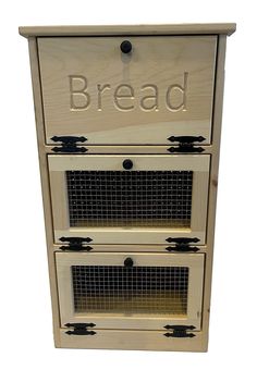 a wooden bread box with the word bread on it's front and bottom drawers