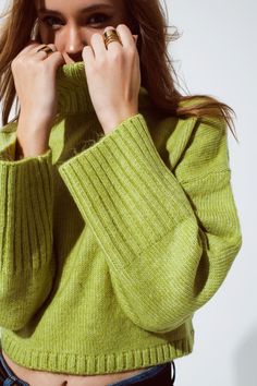 Cropped Chunky Knit Sweater With Turtle Neck In Green Indulge in the comfort of this super soft chunky knit sweater with a stylish turtle neck and wide ribbed cuffs. It features a dropped shoulder for a casual look, making it a versatile choice. Pair it with a denim skirt or palazzo pants; this green color complements everyone beautifully.   Cropped length  Turtleneck neckline  Long sleeves  Relaxed fit  Casual style  Chunky knit  Material: 51% Acrylic, 46% Polyester, 3% Wool  Model is wearing Dark Green Sweater, Green Fits, Chunky Knit Sweater, Color Complement, Online Fashion Boutique, Knitwear Tops, Chunky Knits Sweater, Green Sweater, Palazzo Pants