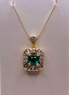 This fabulous 18k yellow gold pendant was created by William Sheahan Designs and features a stunning 0.66 carat emerald-cut emerald, 4=0.33 carat total weight baguette diamond and 13=0.24 carat total weight round brilliant cut diamonds. * Gold chain sold separately Material/Metal: 18k Yellow Gold Stones (1): 0.66 Carat Emerald-cut emerald Stones (2): 4 =0.33 carat total weight baguette diamond Stones (3): 13 = 0.24 carat total weight round brilliant cut diamond  Weight: 2.6Dwt (Pennyweight) / 4. Luxury Emerald Cut Emerald Necklace For Anniversary, Luxury Emerald Cut Emerald Necklace With Diamond Accents, Emerald Cut Baguette Diamonds May Birthstone Jewelry, Emerald Cut Baguette Diamond Jewelry For May Birthstone, Fine Jewelry Gold Emerald Rectangular Necklace, Gold Rectangular Emerald Necklace In Fine Jewelry Style, Fine Jewelry Gold Emerald Necklace, Gold Emerald-cut Necklace With Diamond Details, Gold Emerald Necklace In Fine Jewelry Style