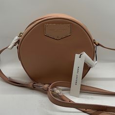 Luxurious Marc Jacobs Nwt Authentic Blush Ballet Pink Round Crossbody Bag Purse Zippered Top Closure Gold Hardware Strap Has A 20” Drop. Measurements: Diameter: 7-1/8” Width: 3” **Comes From A Clean, Smoke Free Home** Designer Blush Bag With Detachable Strap, Blush Crossbody Bag With Detachable Strap, Luxury Blush Crossbody Shoulder Bag, Blush Crossbody Bag With Gold-tone Hardware, Round Crossbody Bag, Bags Marc Jacobs, Pink Round, Ballet Pink, Marc Jacobs Bag