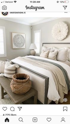 a bedroom with a large bed and white walls