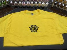 Machine embroidered Over Stimulated Moms Club t-shirt. Offered in unisex sizes s-xxl in yellow, white, or black! Casual Yellow Embroidered T-shirt, Casual Yellow T-shirt With Embroidered Graphics, Relaxed Fit T-shirt With Custom Embroidery For Streetwear, Custom Embroidery T-shirt With Relaxed Fit For Streetwear, Custom Embroidery Relaxed Fit T-shirt For Streetwear, Custom Embroidered Relaxed Fit T-shirt For Streetwear, Yellow Cotton T-shirt With Embroidered Graphics, Yellow Embroidered Short Sleeve T-shirt, Yellow Cotton Top With Embroidered Graphics