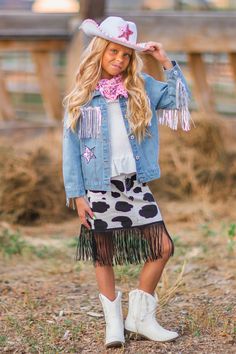 Set comes with top, skirt & bandana White top & cow print skirt can be worn by themselves or with the set Skirt features black fringe Ultra soft material for comfort & ease Your little girl will be having a wild fun time in this Cowgirl Costume! This girls' costume is styled with a white puff sleeve top, fringe cow print denim skirt & pink bandana, making it a staple addition to her Halloween or dress up wear. This set looks adorable worn on its own, or simply add some leggings on cooler days. P Cowgirl Outfits For Girls, Girls Cowgirl Outfit, Cowgirl Family Costumes, Diy Cowgirl Costume, Toddler Cow Girl Costume, Girl Halloween Costume, Girls Halloween Costume Ideas, Toddler Cowgirl Costume, Diy Cowgirl Outfit