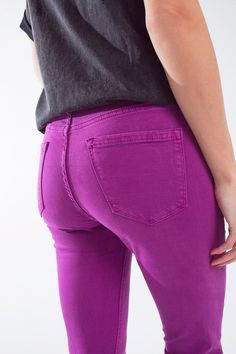 Introducing our Fuchsia Ankle Super Skinny Jeans with Soft Wrinkles – a vibrant addition to your denim collection that seamlessly combines style and comfort. These fuchsia skinny jeans, crafted from stretch denim, promise both a pop of color and a flattering fit for everyday wear.  The ankle length and super skinny silhouette bring a modern edge to this wardrobe essential, making it perfect for a wide range of occasions. The soft wrinkles add a touch of casual charm, enhancing the laid-back yet chic vibe of these jeans.  Designed for everyone and everyday use, these jeans feature five pockets and a zip fastening, ensuring both functionality and a classic denim look. The stretch denim composition of 97% Cotton and 3% Elastane provides flexibility and ease of movement.  Our model, confidentl Pink Stretch Jeans For Fall, Stretch Pink Jeans For Fall, Pink Cropped Leg Trendy Bottoms, Vibrant Fitted Pink Bottoms, Purple Mid-rise Cotton Jeans, Vibrant Stretch Bottoms, Pink Stretch Cropped Pants, Pink Stretch Cropped Leg Pants, Spring Purple Jeans With Relaxed Fit